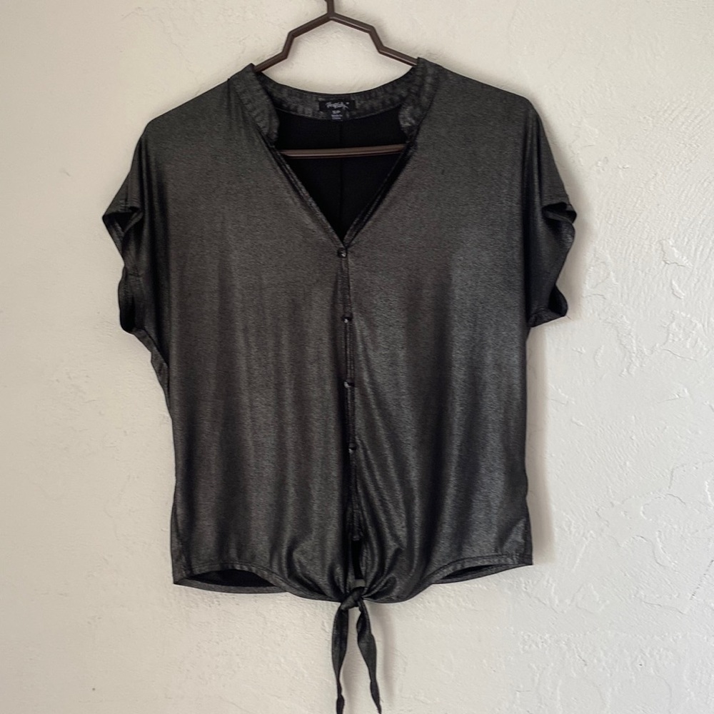 Women’s size small shiny black short sleeve shirt buttons and a tie in the front